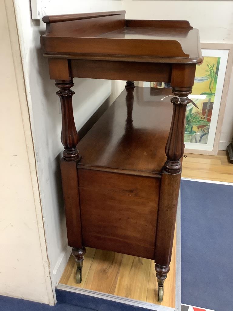 A Victorian mahogany dumb waiter with cupboard below